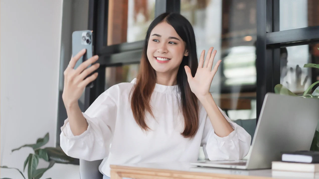 A woman taking a lesson on her phone