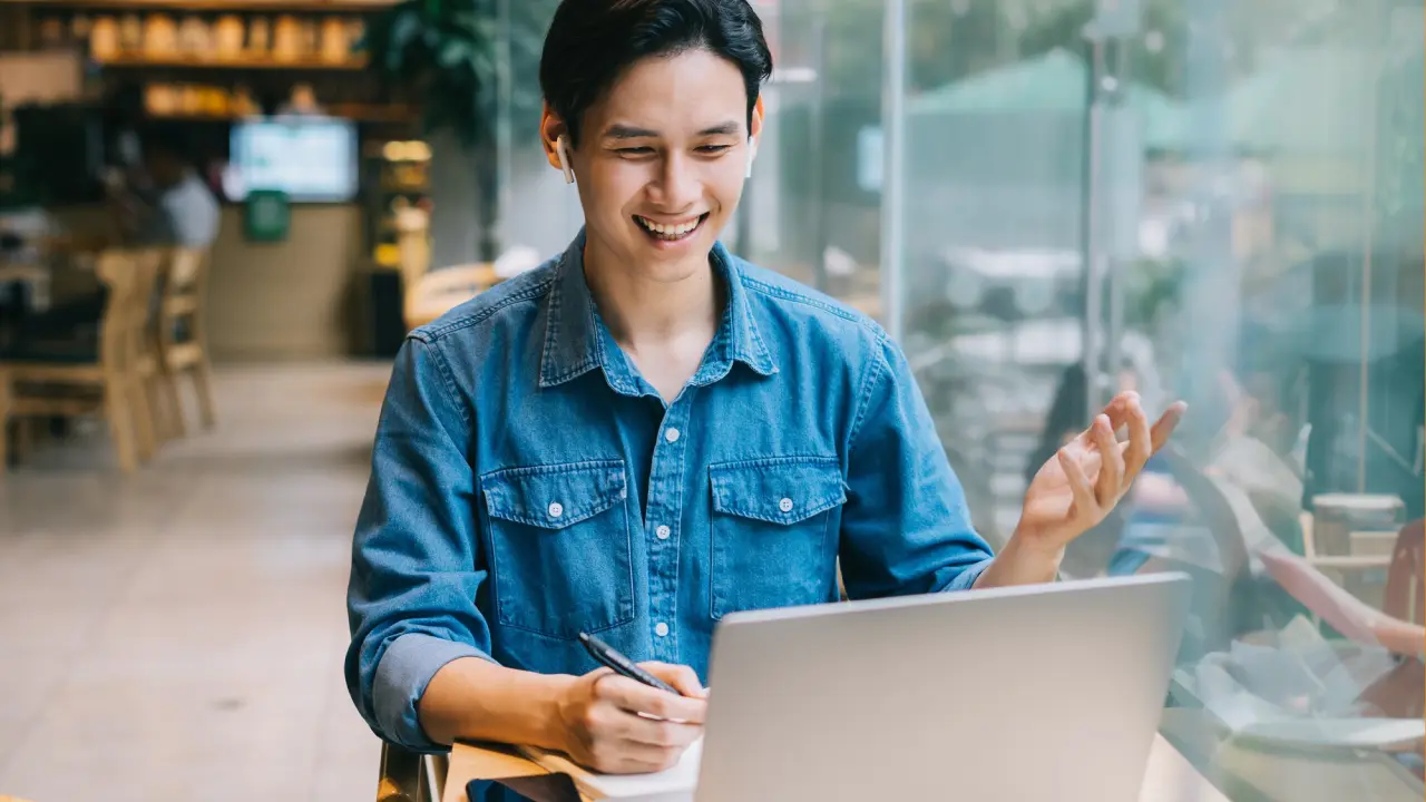 A man taking a lesson on his laptop