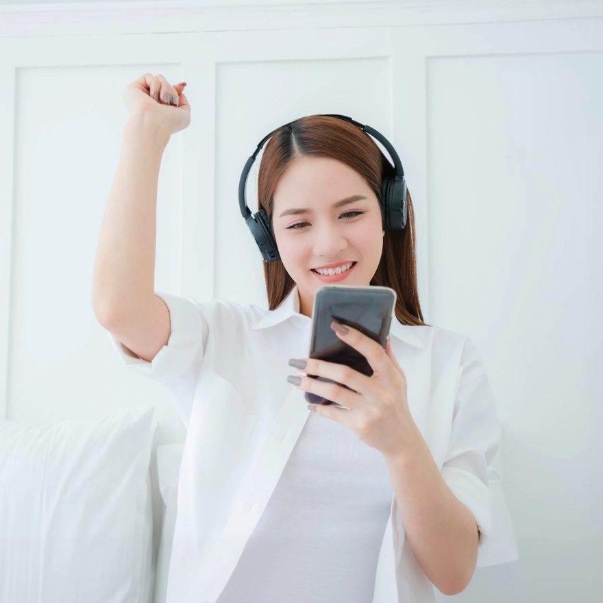 A woman studying with headphones